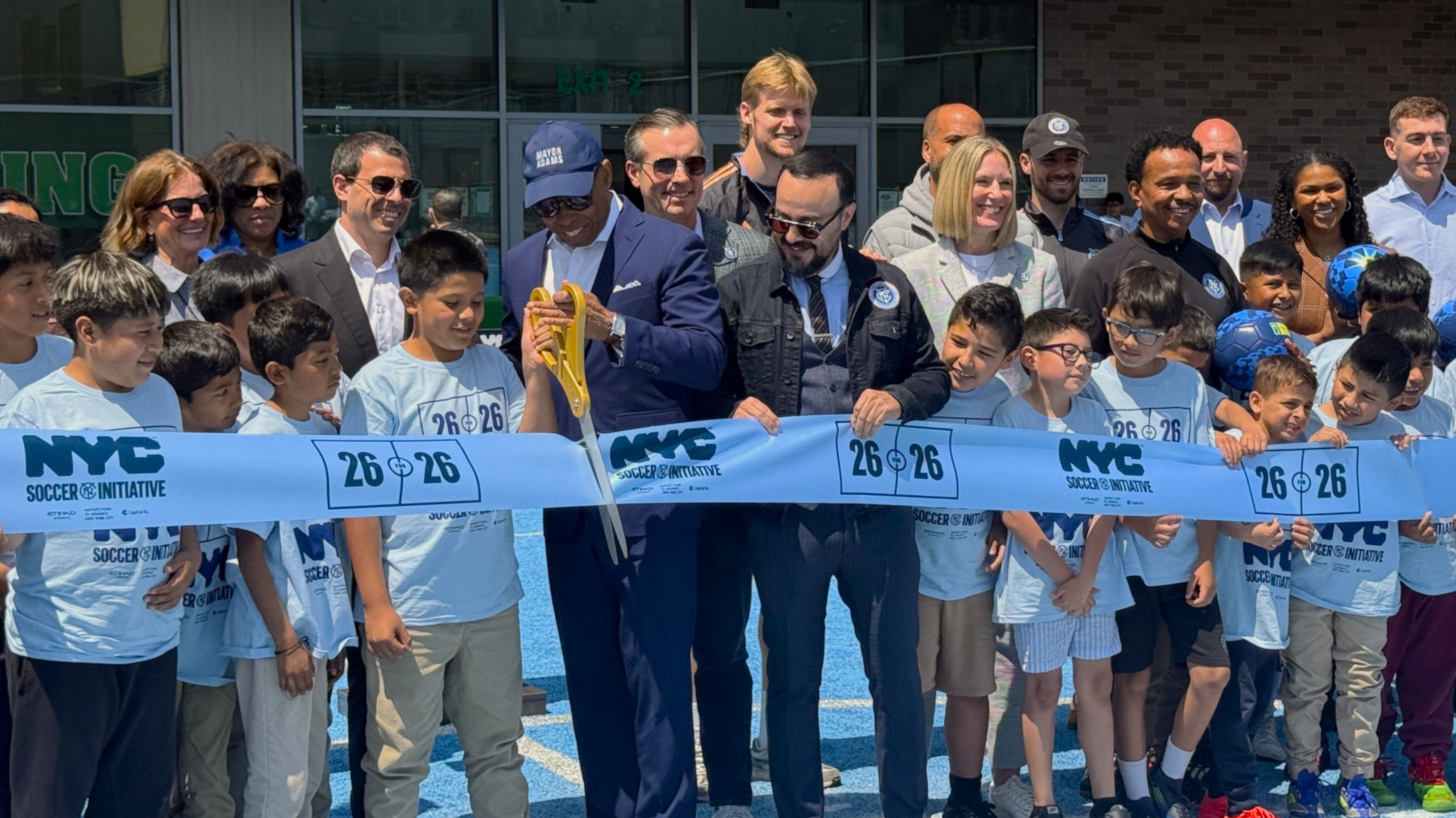 Group of people having a ribbon cutting ceremony