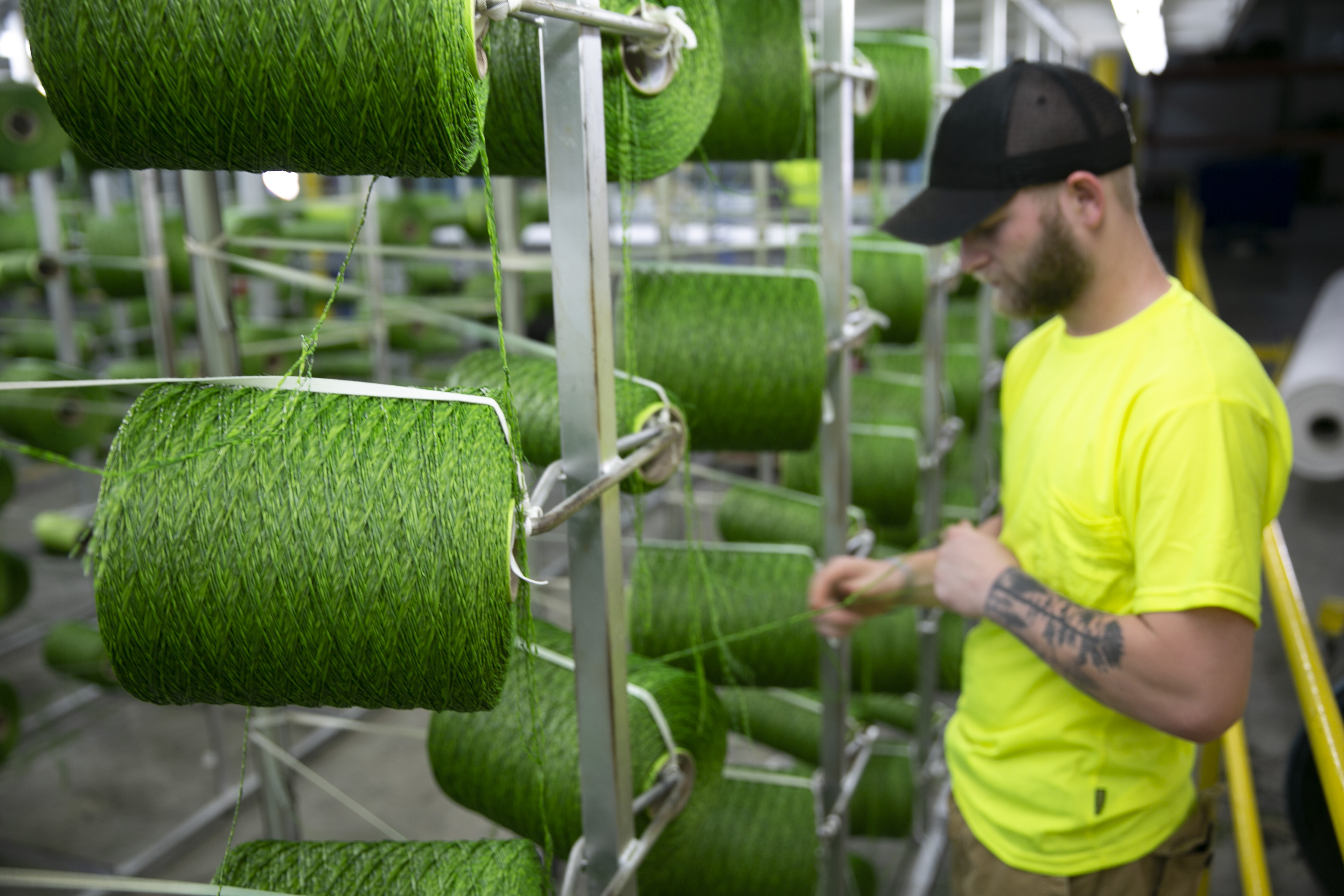 Employee with yarn rack